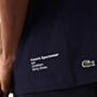 Lacoste Short Sleeve T Shirt in Navy Blue with white writing on the bottom right of the back of the t shirt 